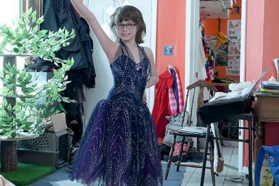 Trans girl Ren poses in a dress she will wear in the Lil Miss Westie pageant.